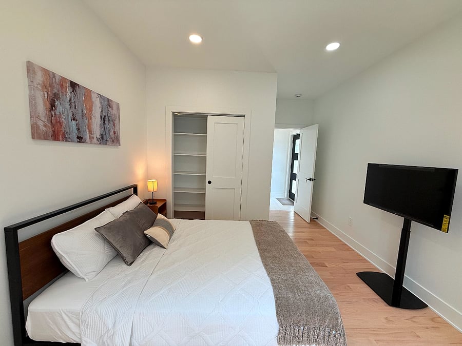 Ensuite bedroom with brand-new closet system, and private entrance