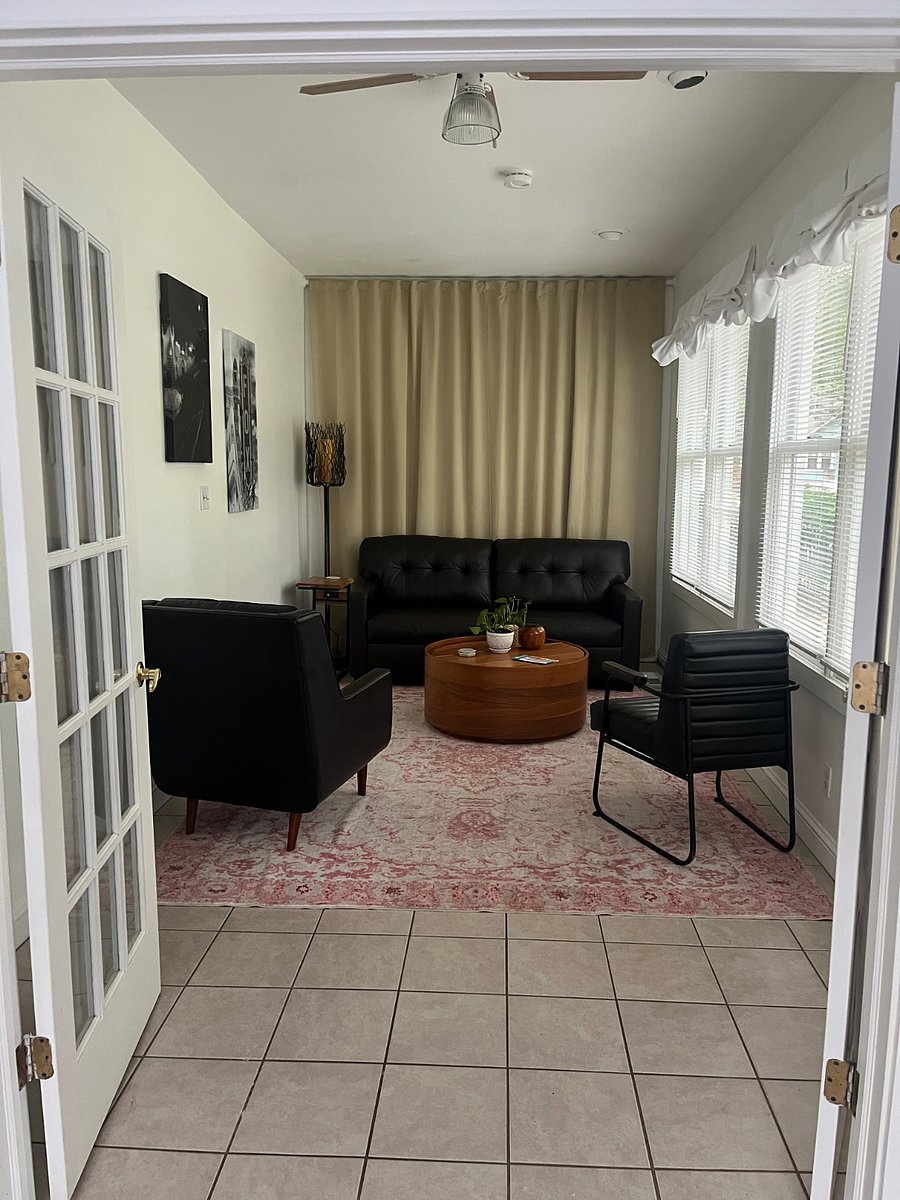 Greeting room (full sofa bed) or could be an office space.