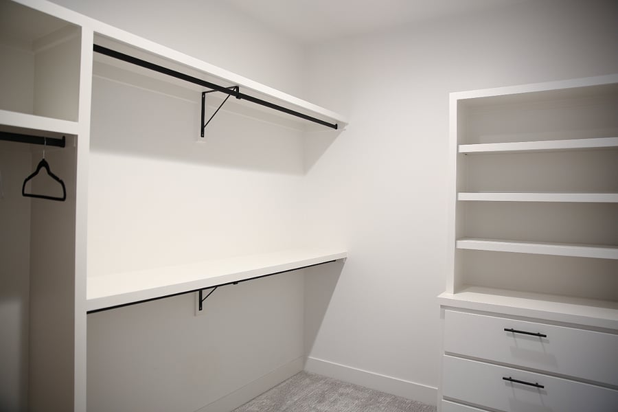 Large walk-in Closet connecting laundry room and master bathroom