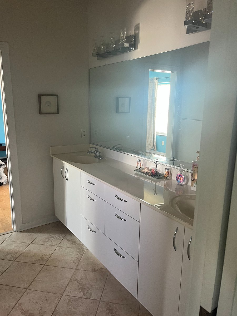 Double vanity with shower/bath and toilet in separate connecting room for privacy