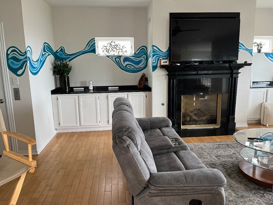 Great room with fireplace and sliding glass doors to the 2nd floor deck