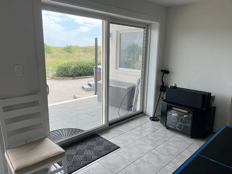 Doors opening to the deck and the beach
