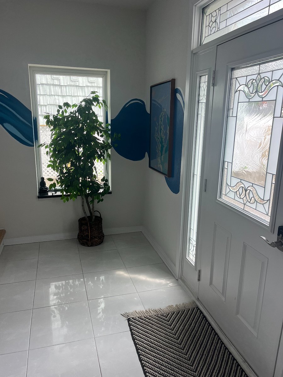 Door leading to the driveway with onsite parking for up to 4 cars