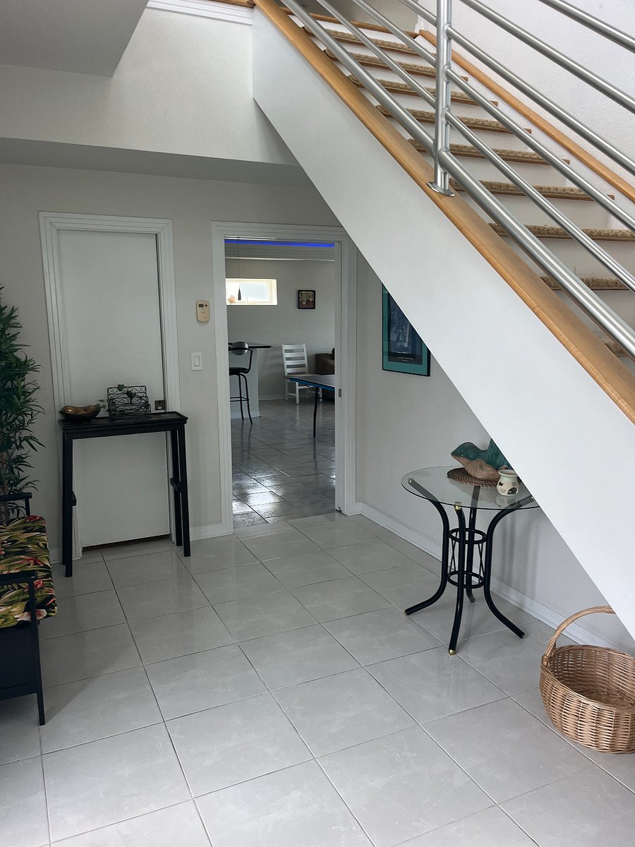 Foyer leading to first floor and stairs to second floor