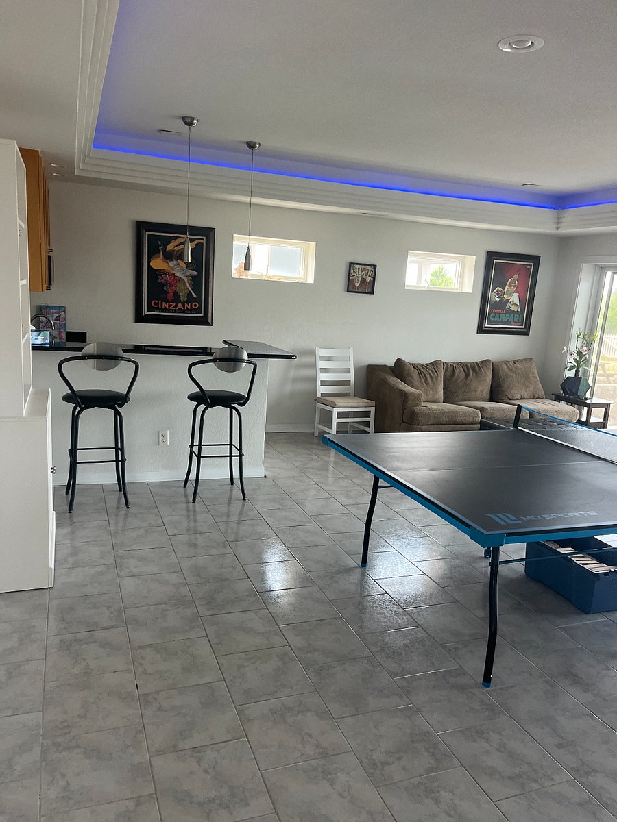First floor large family room with ping pong table and wet-bar