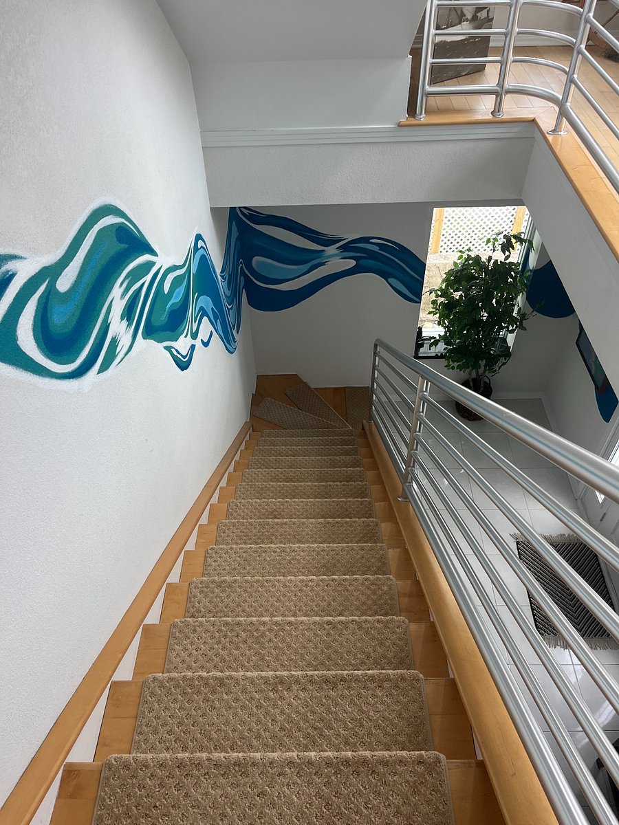 Down the stairs leading to the foyer