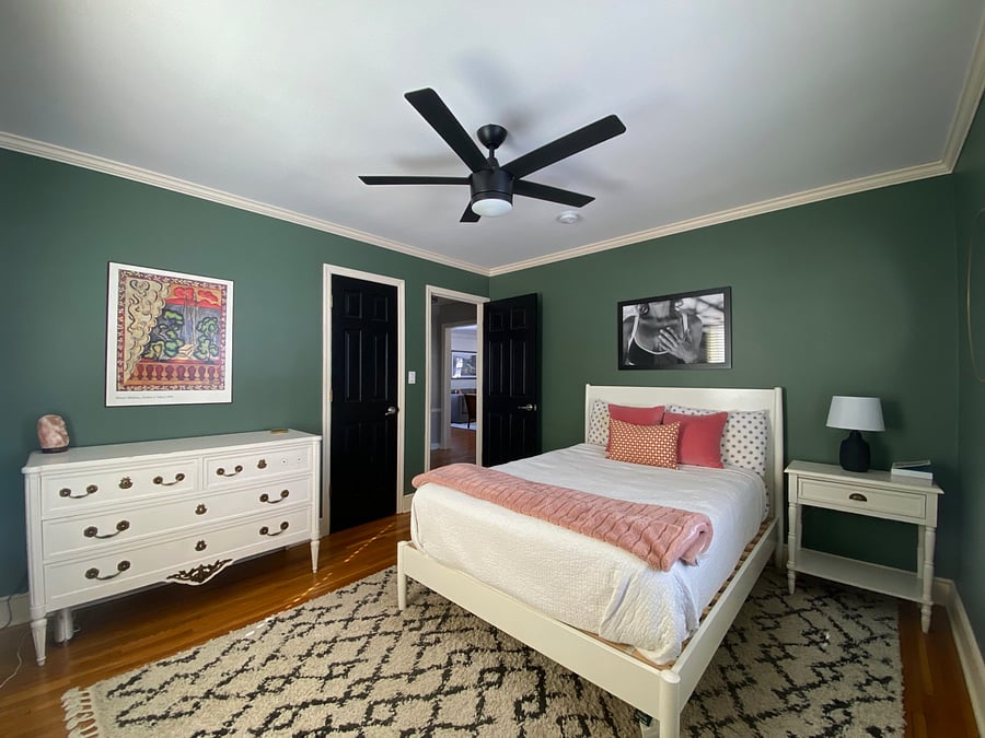 Main floor bedroom with plenty of closet space and a dresser.