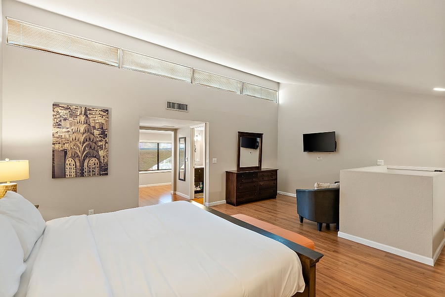 The loft's open concept and elevation give it both a sense of privacy and connection to the rest of the home. Complete with a sitting nook to catch up on your favorite shows.