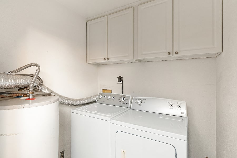 You have a dedicated, private laundry room equipped with a full-size washer and dryer. Because its tucked away with its own patio access, you can throw in a load of dusty hiking gear or dirty scrubs and let the spin cycle run without it interrupting your Netflix binge in the living room. Plus, there's plenty of overhead cabinet space to stash your detergent and keep things organized.