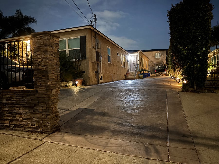 Street view.   Tall building in back
Driveway not to be blocked.