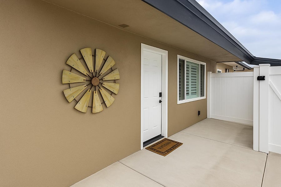 Inviting Front Entry
Welcome home through a beautiful front entryway featuring a private patio perfect for relaxing outdoors. The windows are accented with classic wood shutters, adding charm and privacy, while the entry area itself is well-kept and inviting.