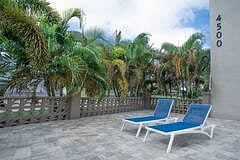 Pool area with lounge chairs.