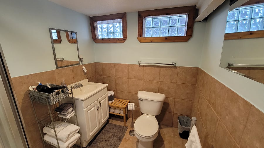 Bathroom with plush towels, a towel warmer, hair dryer, shampoo and conditioner, body lotion and other amenities available.  