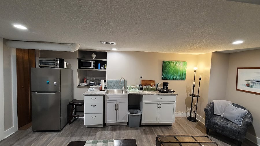 Kitchen has microwave, toaster oven, crock pot, air fryer and countertop burners.  There is a tea kettle, coffee pot, French press, with starter package of coffee and a variety of tea bags.  New dishes, glassware and cutlery on built in shelves.  A variety of utensils available with other additional cooking amenities. 