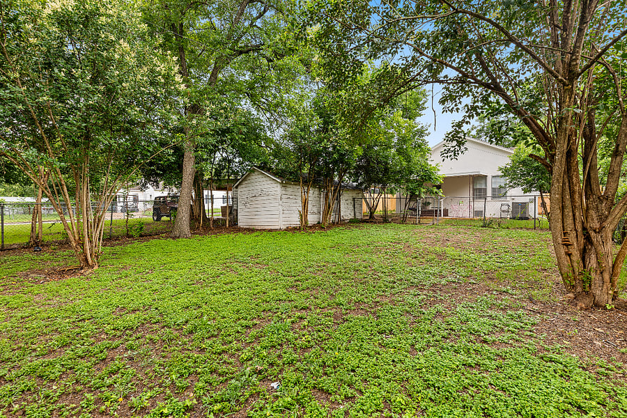 Large fenced backyard.