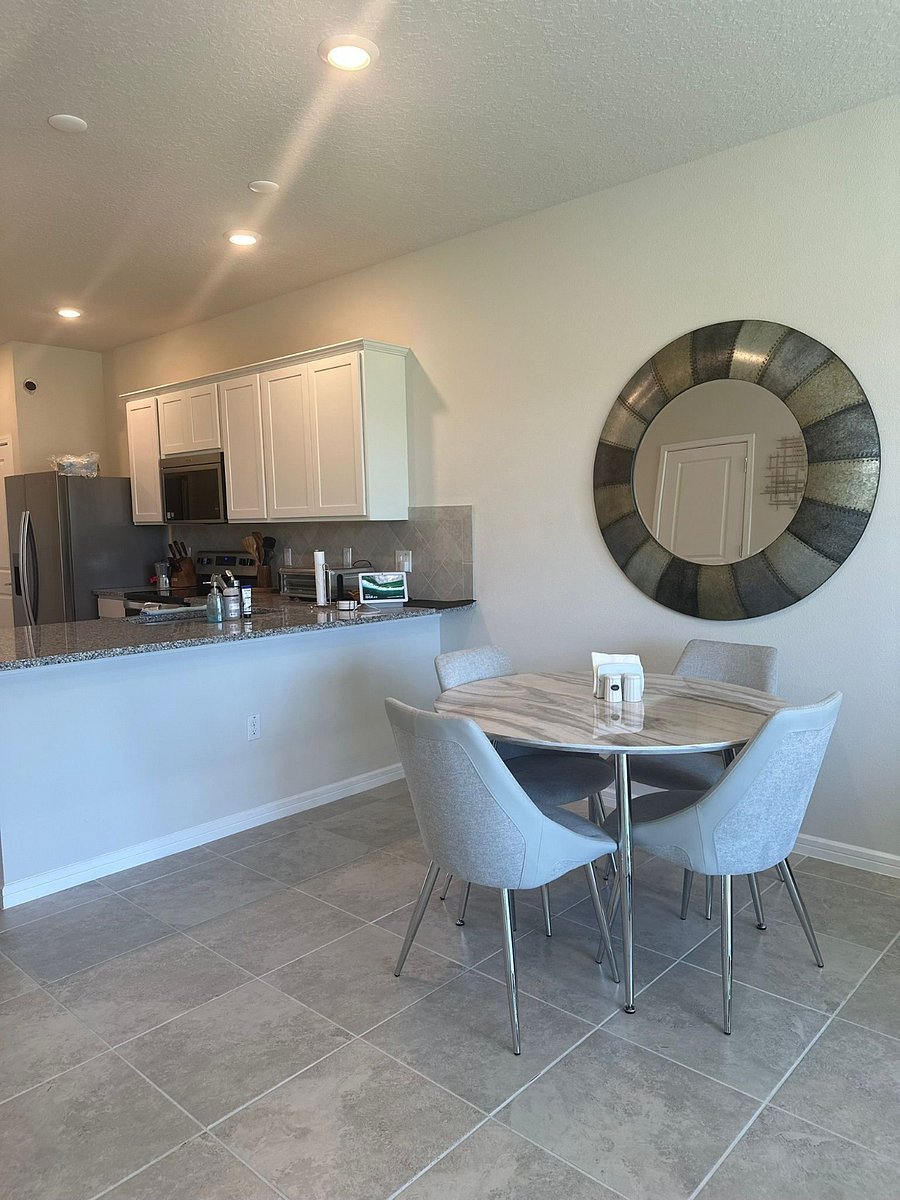 Dining area includes a table with seating for four.