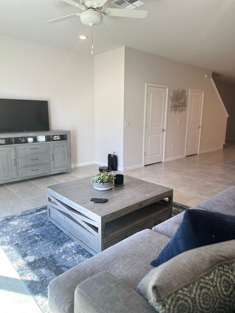 Living room includes a 55" QLED Fire TV and entertainment system for streaming and relaxing.
