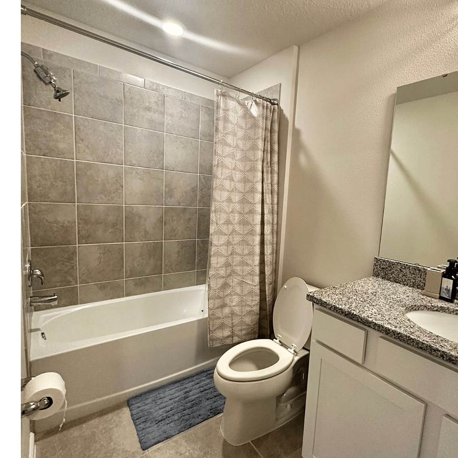Second upstairs bathroom features a bathtub for added comfort.