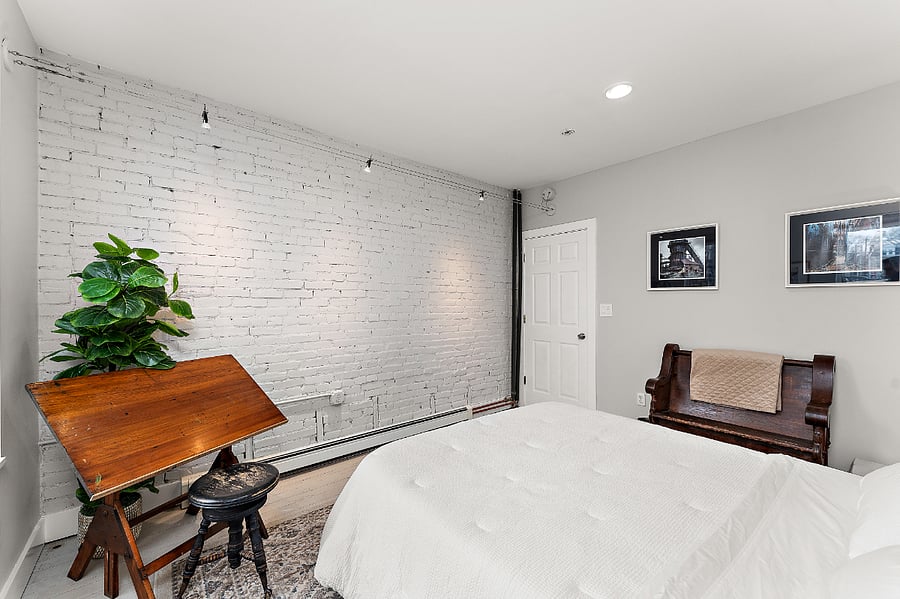 The White Room: Second floor bedroom with queen size bed and antique drafting table. Pittsburgh themed art of Carrie Blast Furnace and former Civic Arena. Gallery lighting.