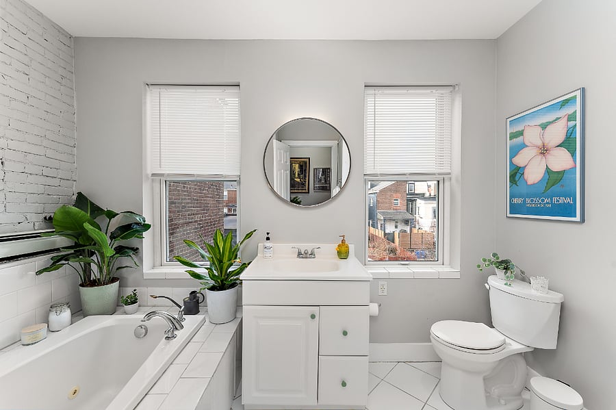 Light filled second floor bathroom, jacuzzi soaking tub and shower.