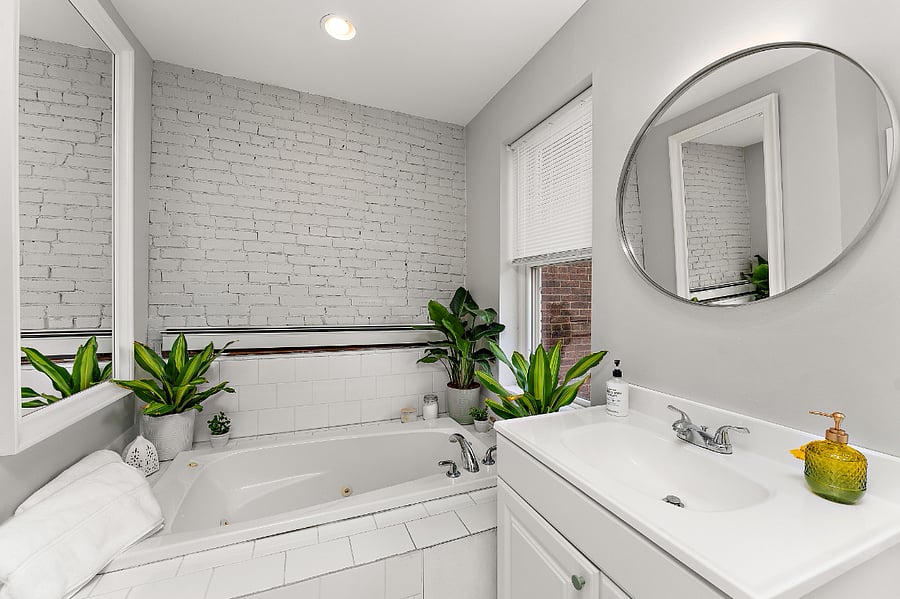 Light filled second floor bathroom, jacuzzi soaking tub and shower.