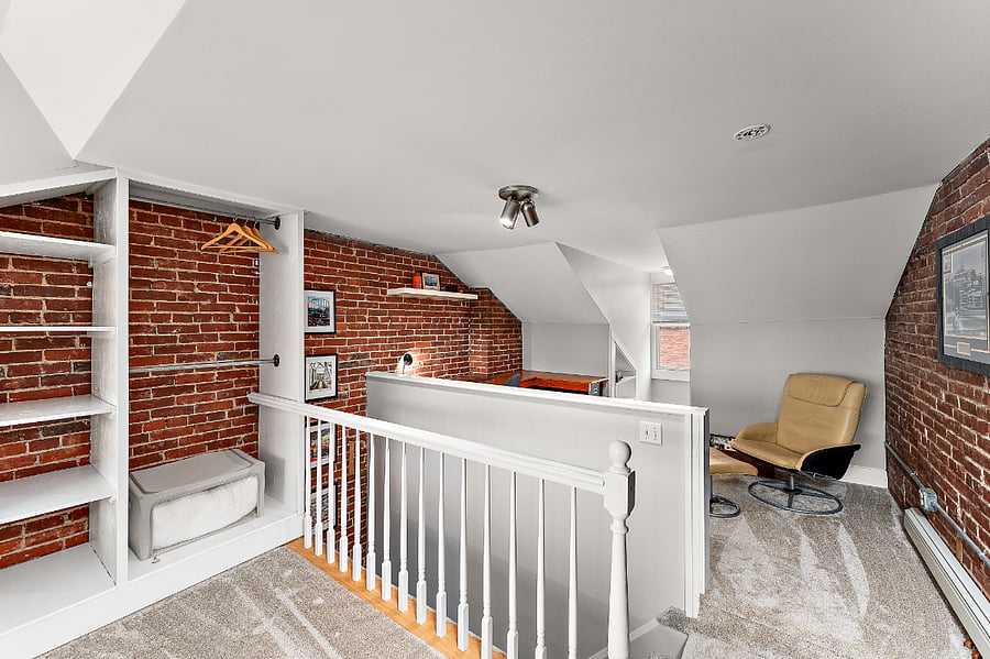 The Loft: third floor bedroom with king size bed and dedicated work area. Pittsburgh sports themed art and Kennywood prints.
We have since added a mesh guard to the stairs for child safety.