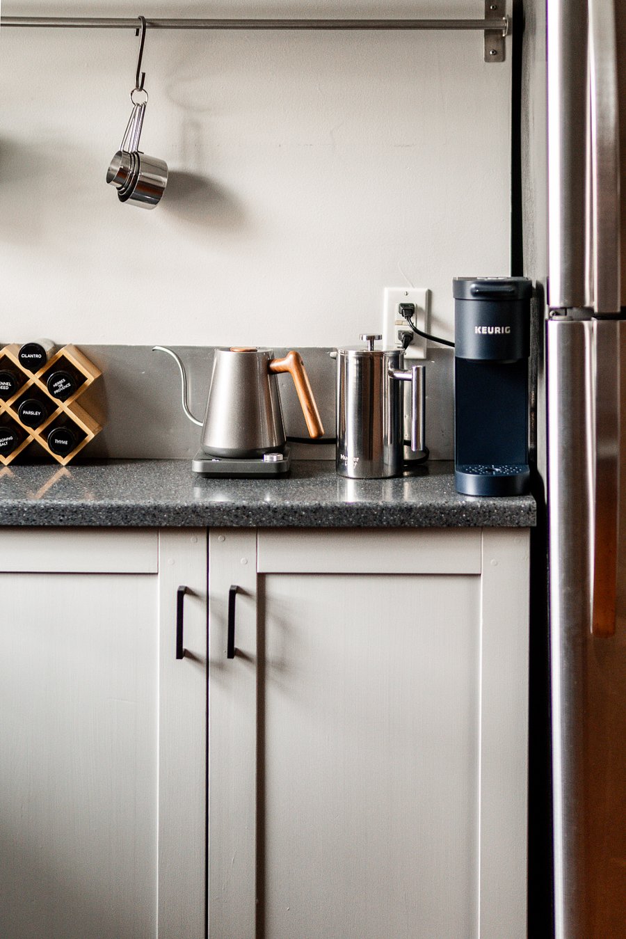 Full spice rack and coffee bar with Keurig, French press, electric kettle, and Soda Stream (not pictured).