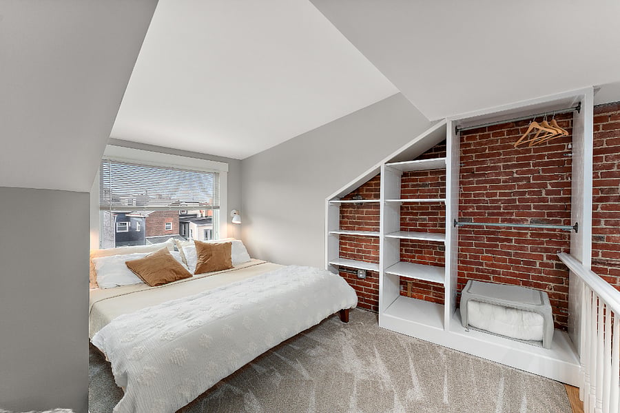 The Loft: third floor bedroom with king size bed and dedicated work area. Pittsburgh sports themed art and Kennywood prints.