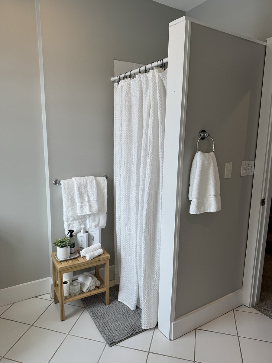 Light filled second floor bathroom, jacuzzi soaking tub and shower.