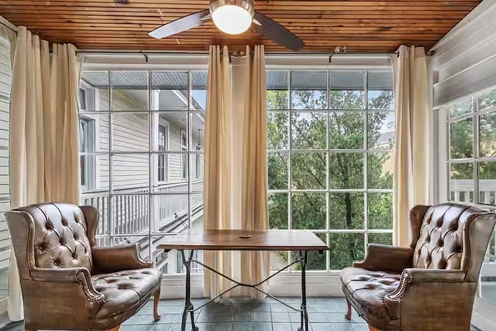 Private sunroom and, on the right side,a door to private outdoor deck.