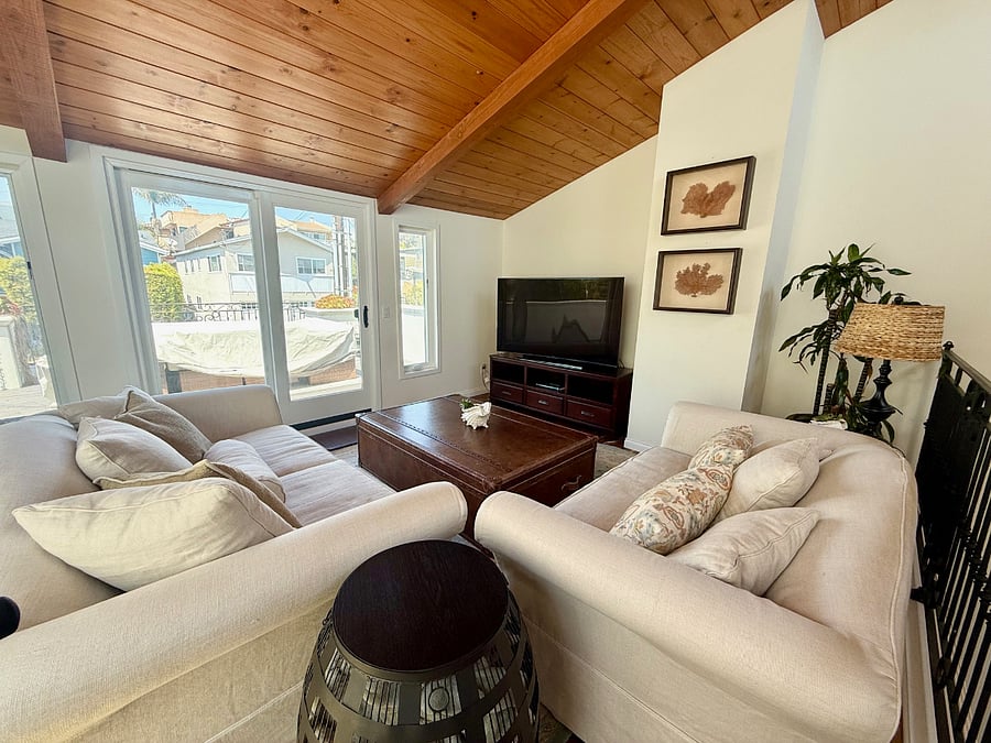 loft with 55" TV and bar, attached deck has seating for 8 and ocean views