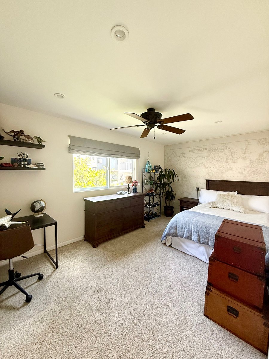 bedroom with full bed and walk in closet