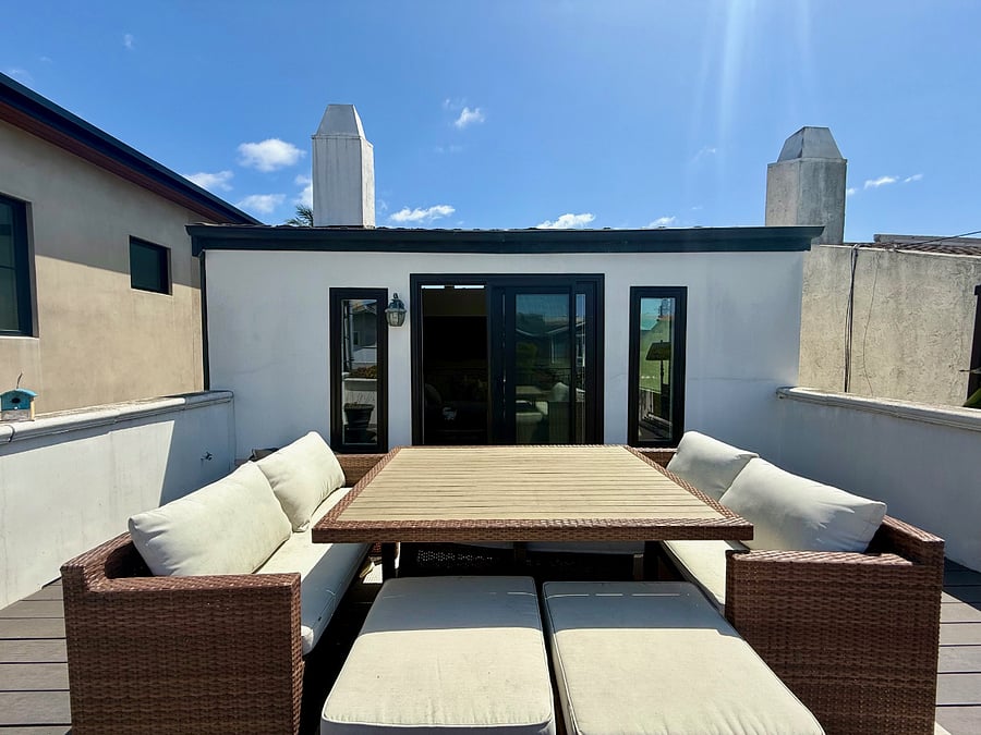 deck with ocean views, succulents and seating for 8