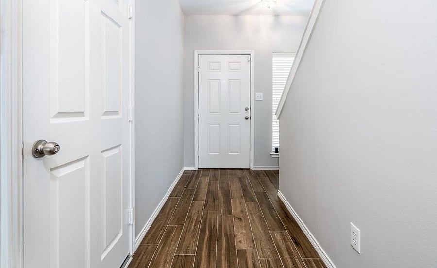 View from Master bedroom, door on the left is the entrance to the garage, on the right are the stairs to first floor.