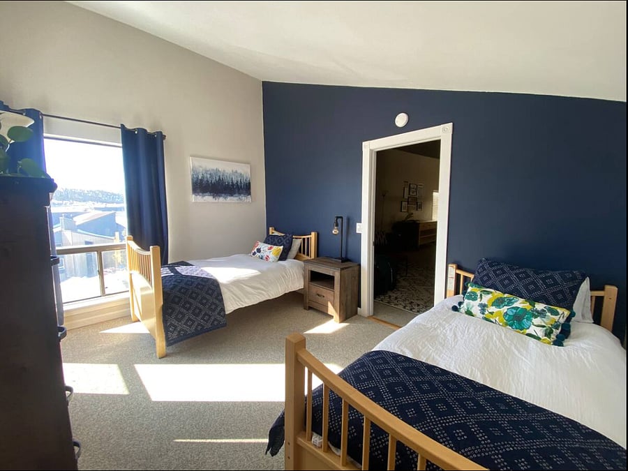 Twin beds in upstairs bedroom in loft. 
