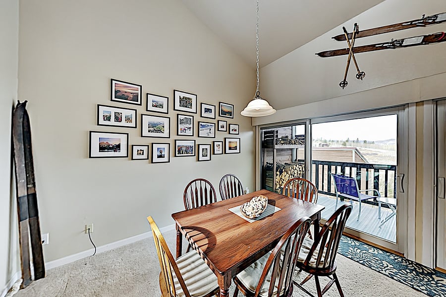 Dining area with seating for 6 at table - additional 4 bar stools can seat people on the kitchen island. 