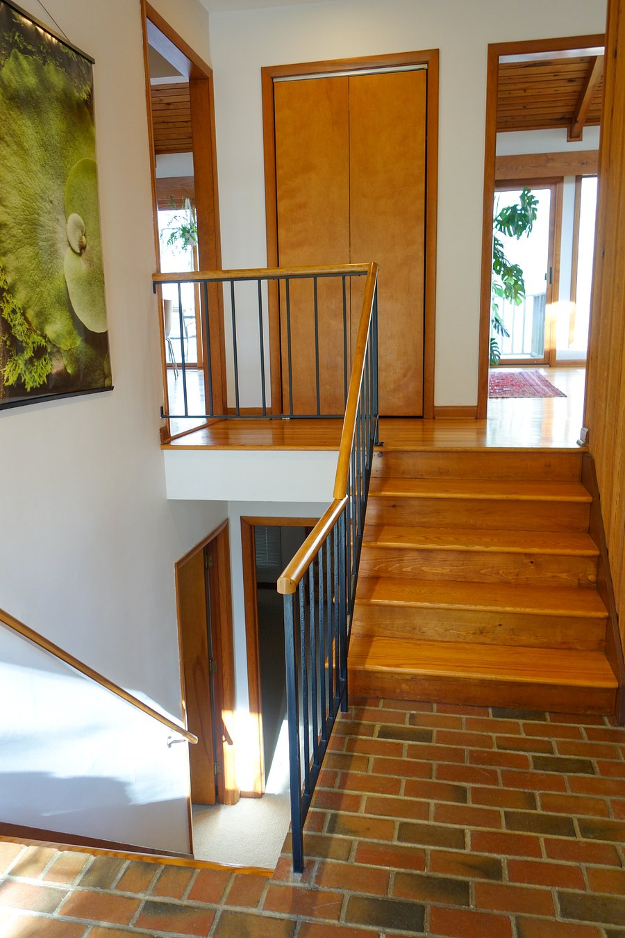 Foyer that is mid-level between upstairs and downstairs.