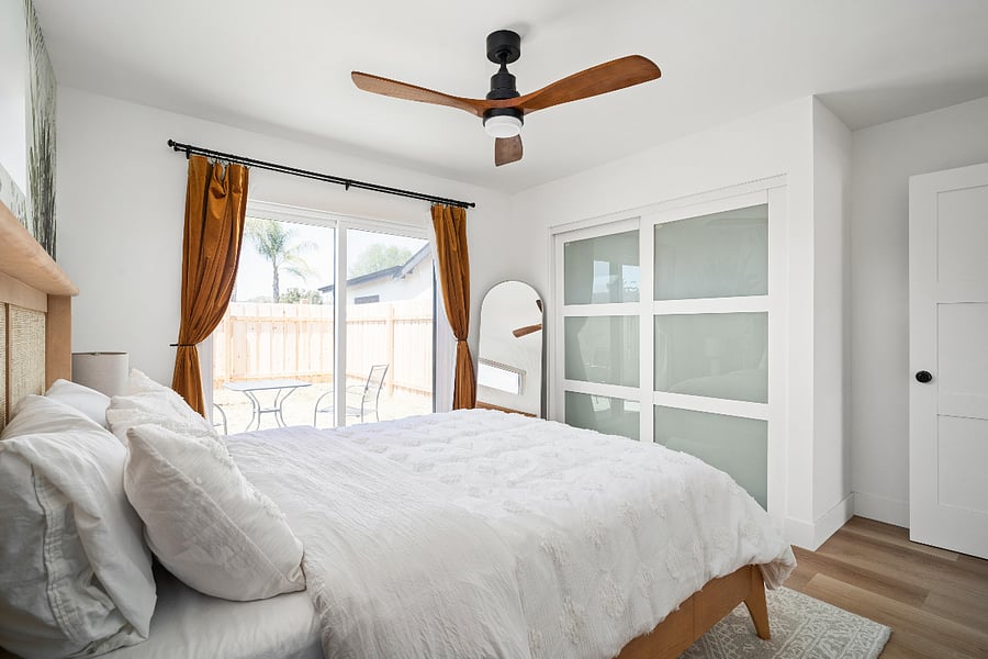 Sliding glass door to your private backyard. The closet has hangers and dresser for additional storage