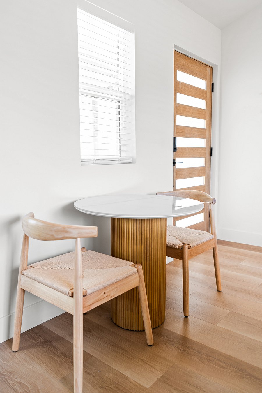 Dining table and chairs with outlet next to the chair