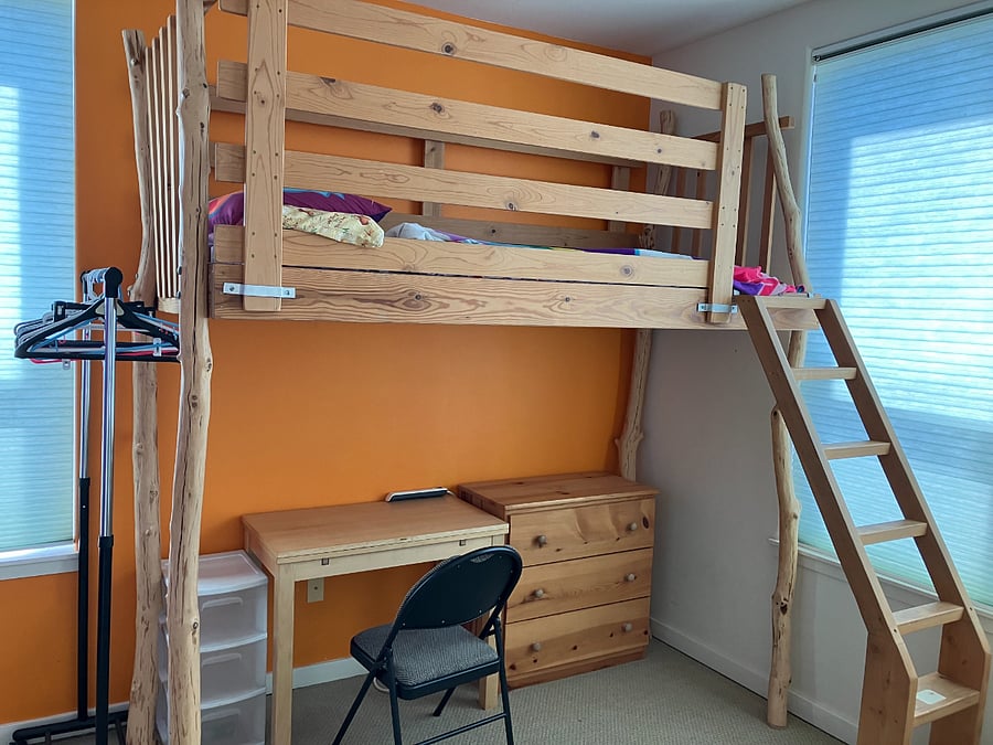 Fourth bedroom has a twin loft bed with work station underneath, clothing rack, small dresser, and bookshelf. Perfect for a student or child.