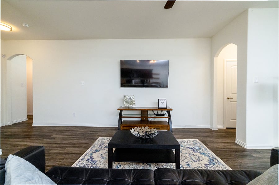 +65 inch TV
+Seating
+Open concept kitchen/living room
+LVP