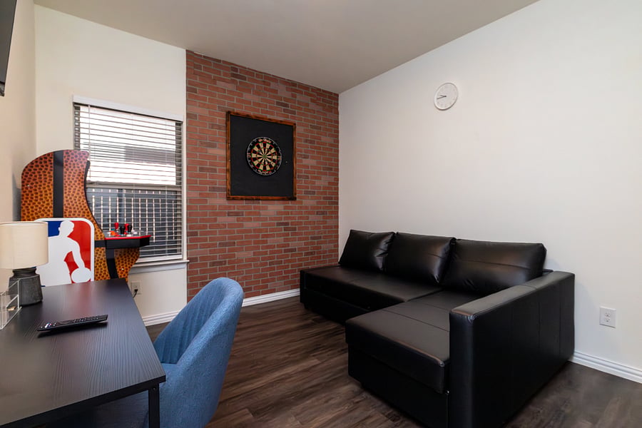 Den Area
+Desk
+Darts
+Video game
+Sleeper sofa