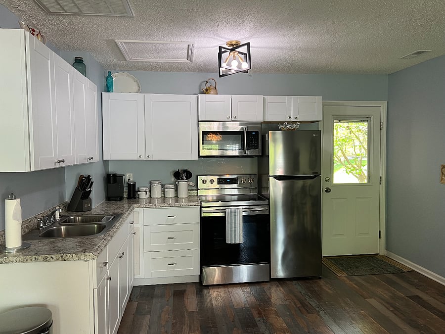 Plenty of cabinet space with baking sheets, dishes, silverware, etc. provided.