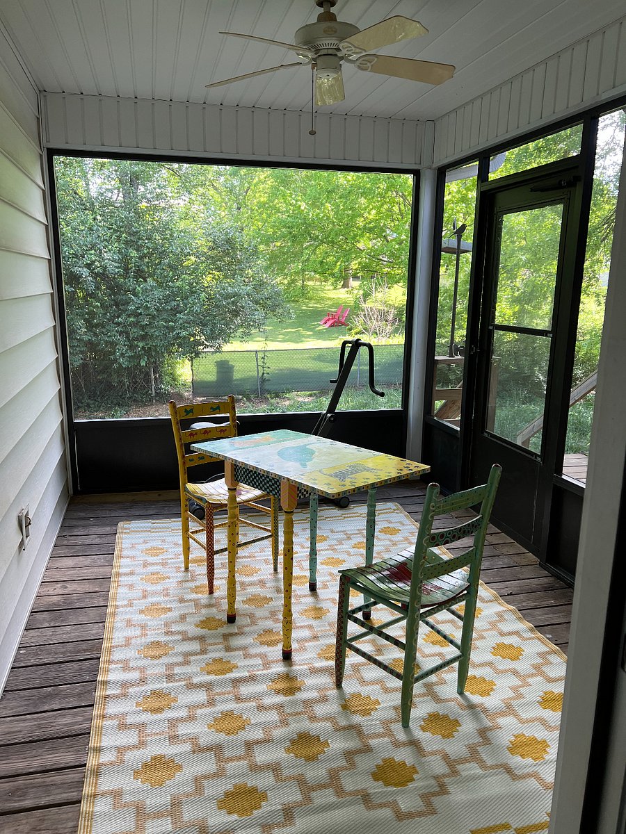 Door leading to back deck and fenced in yard.