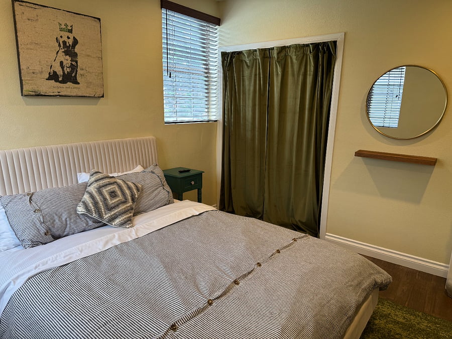 Guest bedroom, plenty of closet space & vanity.