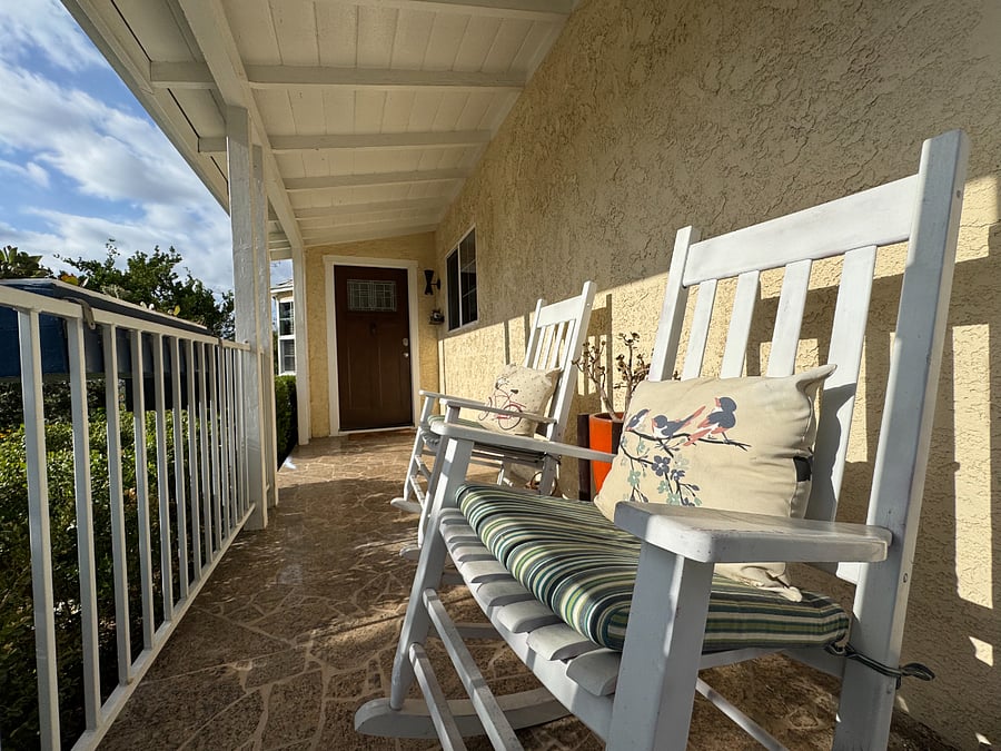 Covered front patio perfect for a smoke, coffee, cocktail or bird watching.