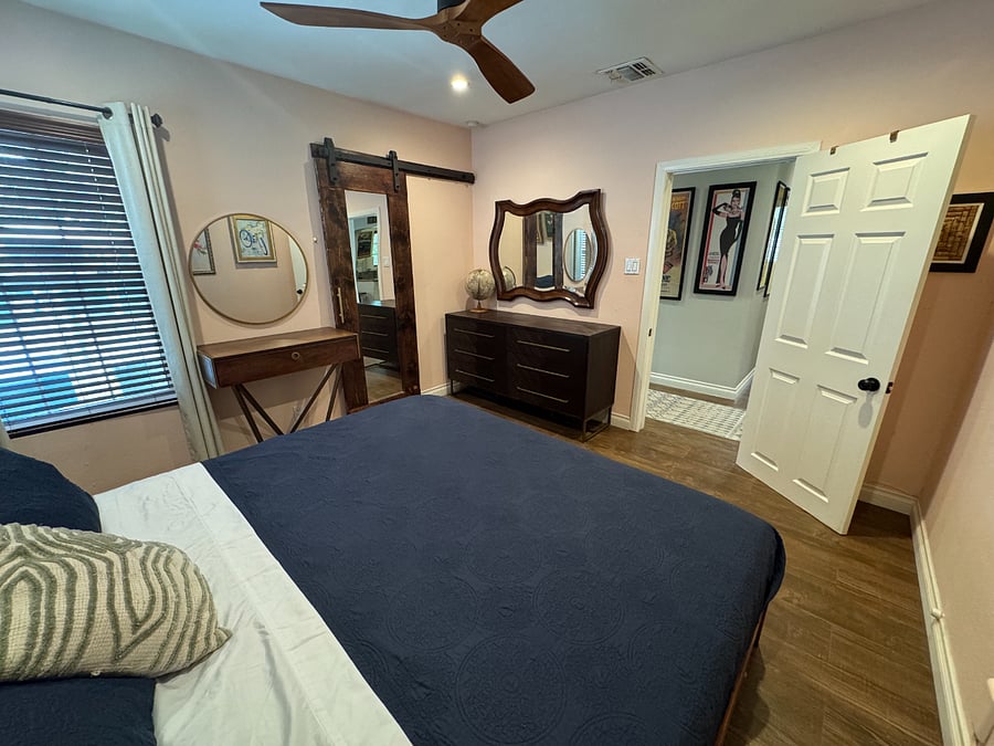 Master bedroom with dresser and closet - enough room for two.
