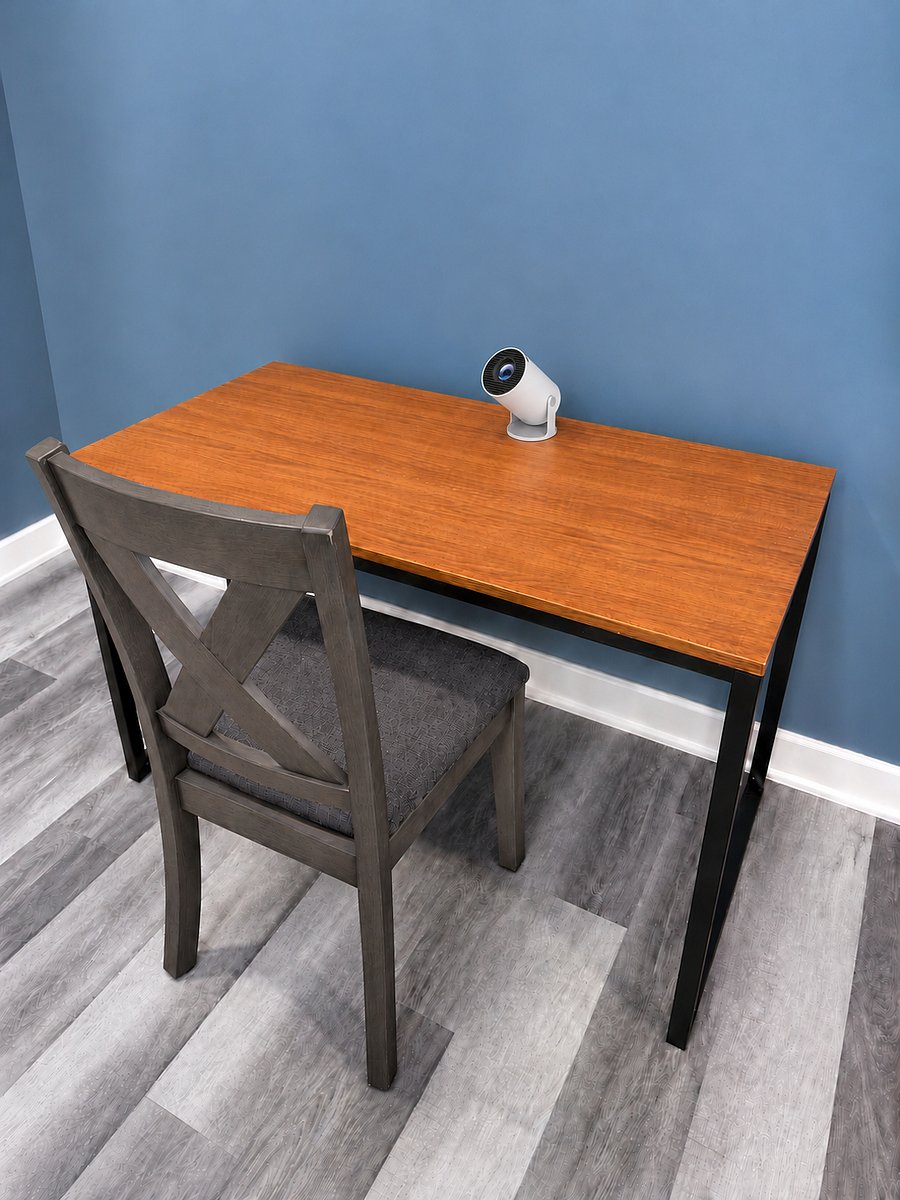 Workspace includes desk, chair and projector. Computer and other accessories not provided.