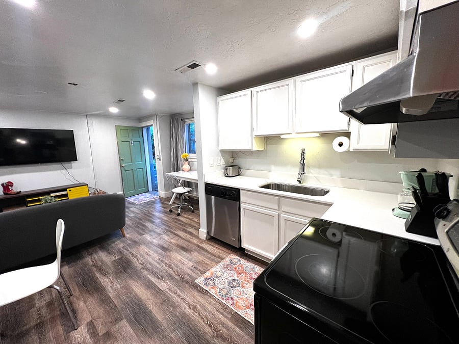 Updated kitchen with stainless steel appliances and quartz countertops.