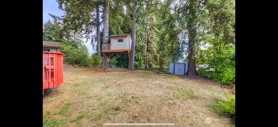 Backyard deck and fully fenced yard.